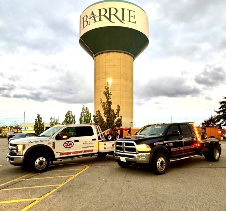 Budget Barrie Towing trucks in front of the Barrie water tower